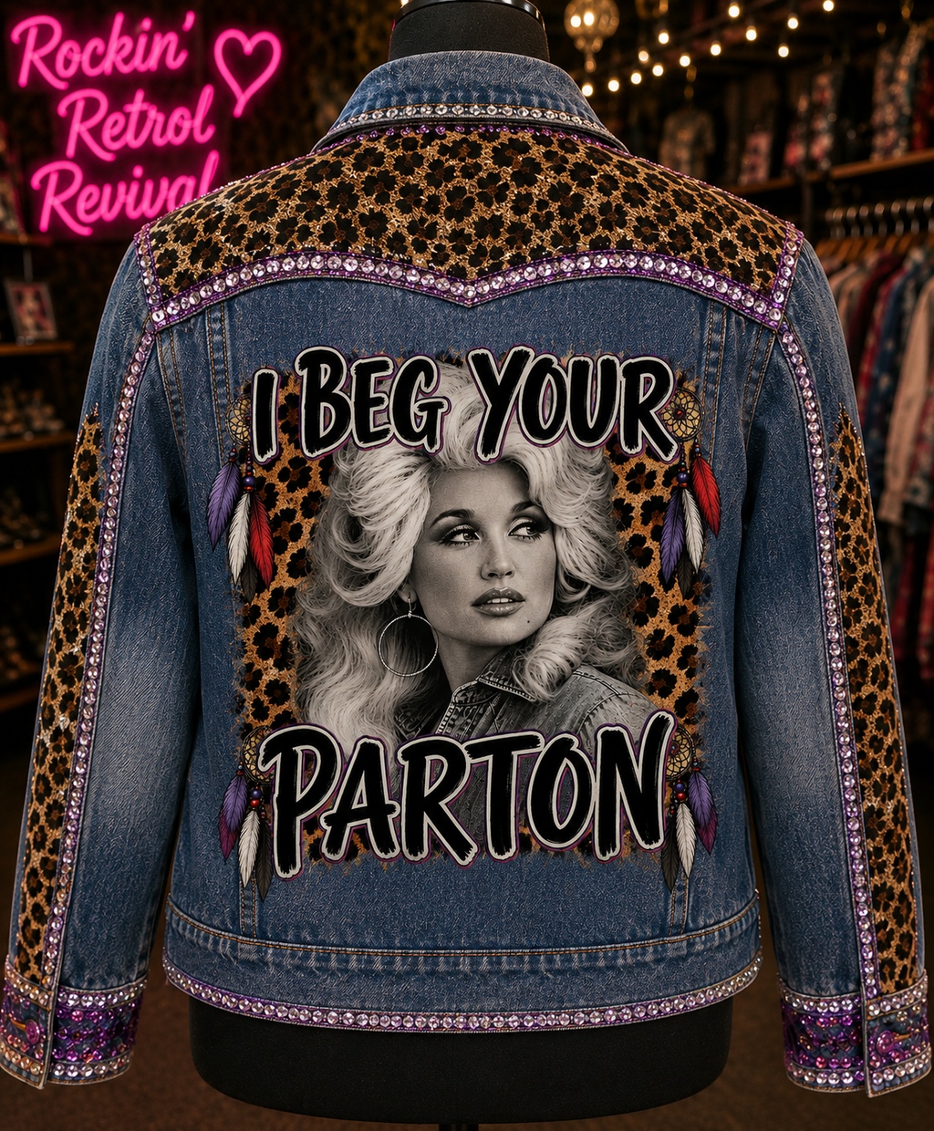 I Beg Your Parton blue denim jacket back view on mannequin with leopard print panels, purple rhinestone trim and feather accents